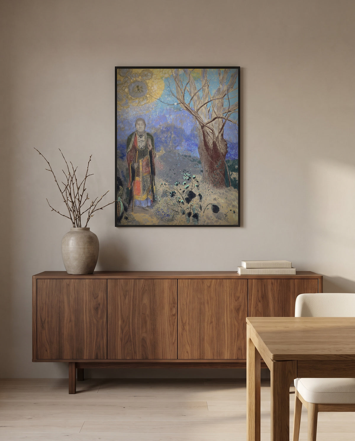 The Buddha by Odilon Redon in a black frame above a walnut sideboard in a dining room