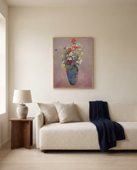 Vision. Vase of Flowers by Odilon Redon framed in natural oak above a cream sofa in a warm living room