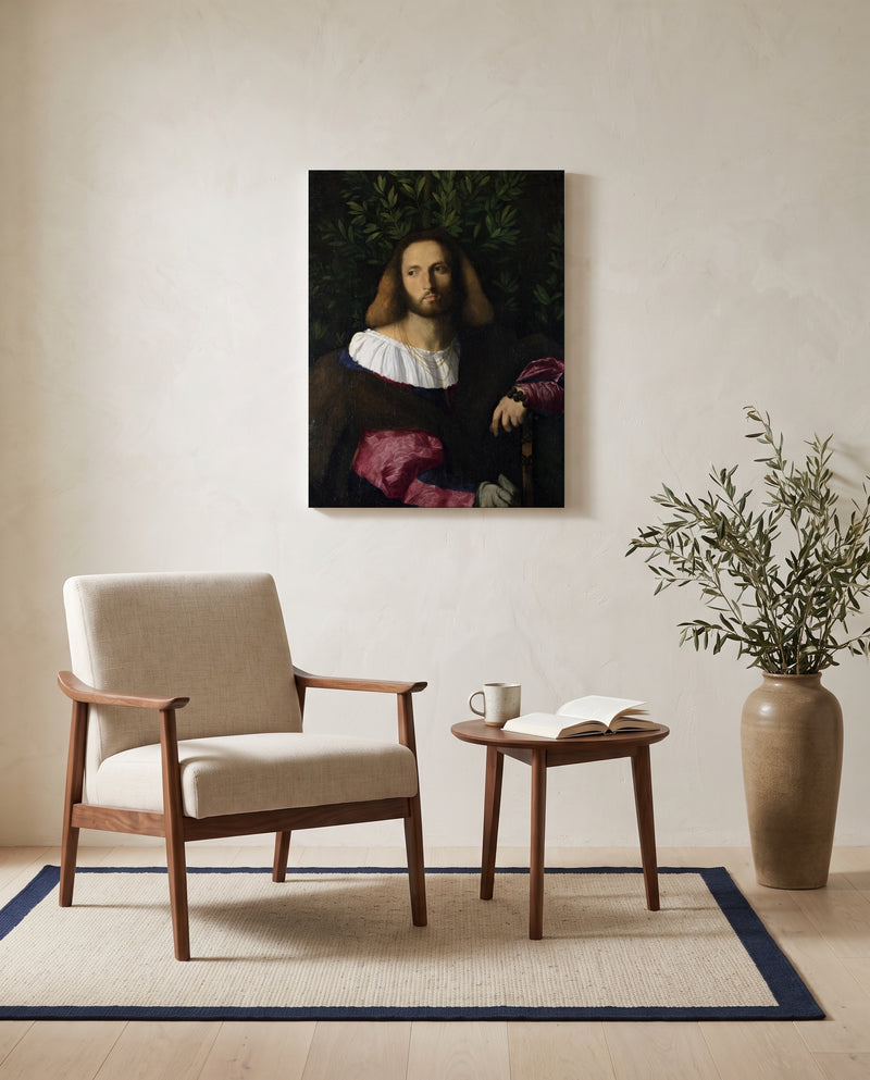 Portrait of a Poet by Palma Vecchio as a stretched canvas above a linen lounge chair in a reading corner