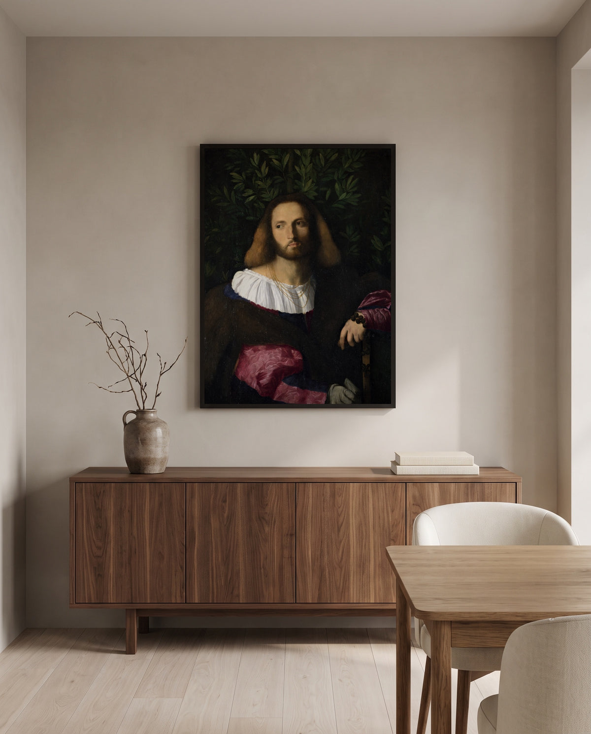 Portrait of a Poet by Palma Vecchio in a black frame above a walnut sideboard in a dining room