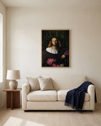 Portrait of a Poet by Palma Vecchio framed in natural oak above a cream sofa in a warm living room