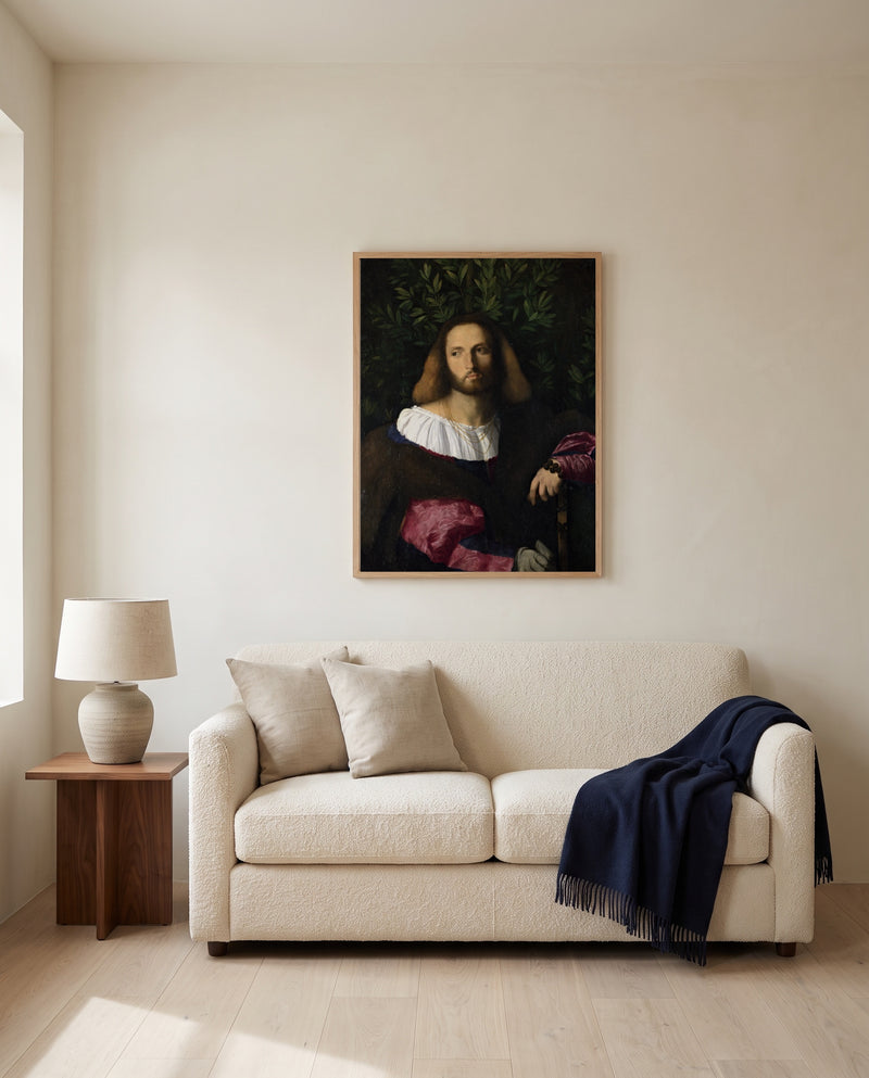 Portrait of a Poet by Palma Vecchio framed in natural oak above a cream sofa in a warm living room