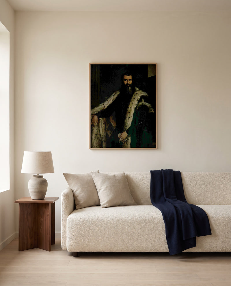Gentleman in a Fur by Paolo Veronese framed in natural oak above a cream sofa in a warm living room