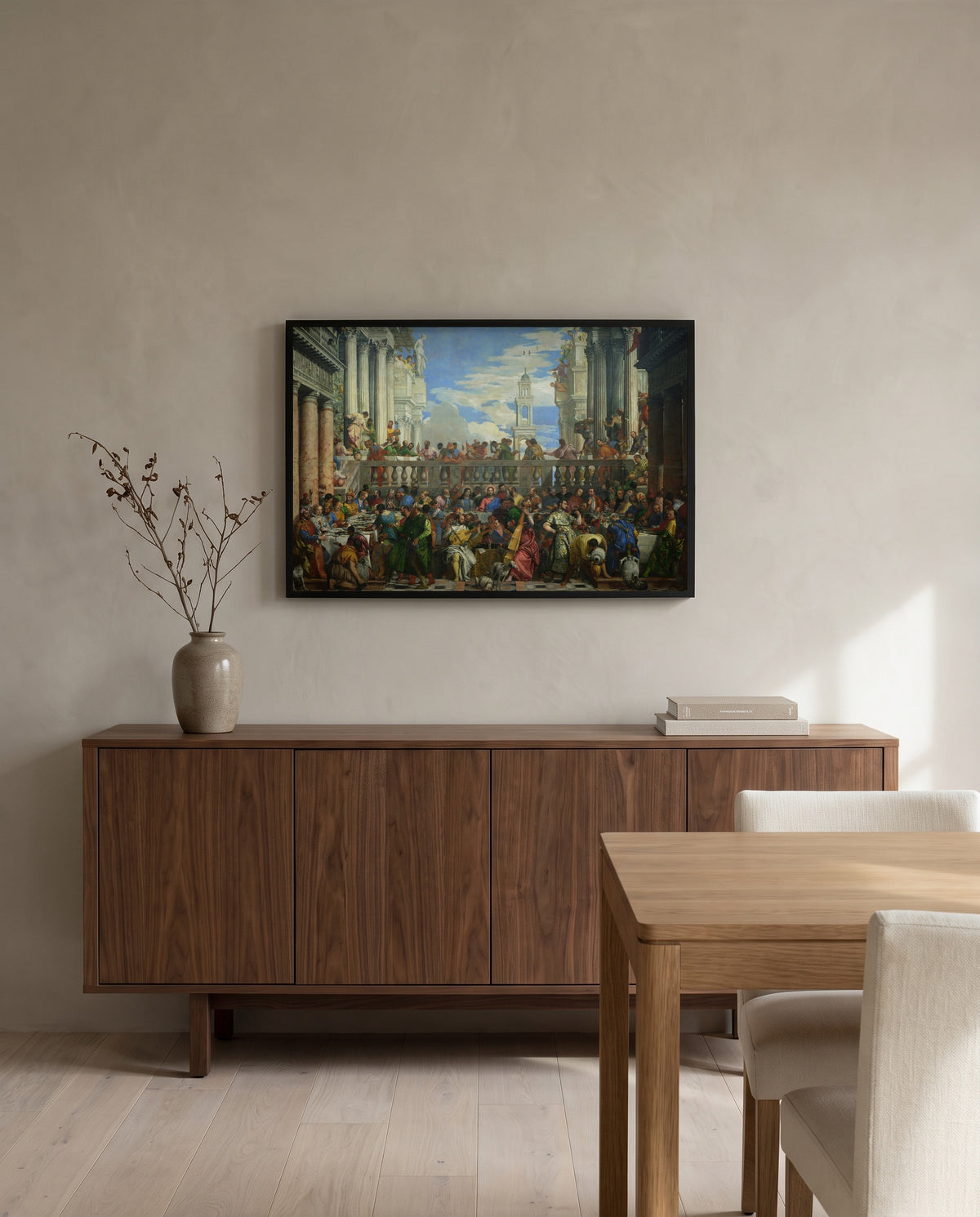 The Wedding at Cana by Paolo Veronese in a black frame above a walnut sideboard in a dining room