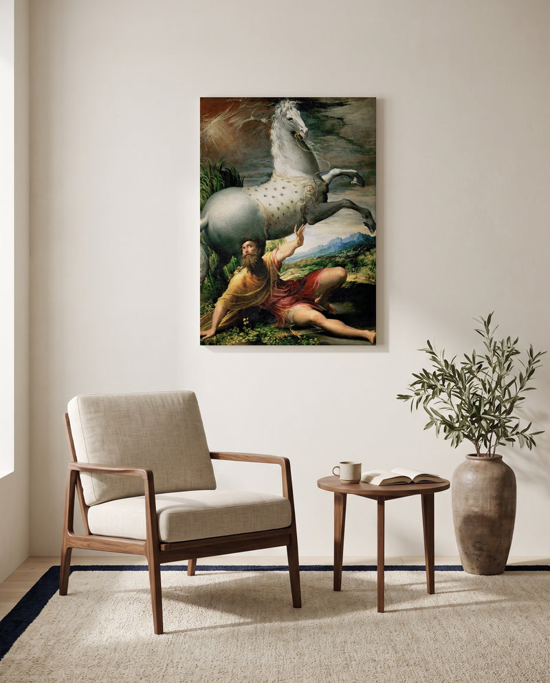 Conversion of Saint Paul by Parmigianino as a stretched canvas above a linen lounge chair in a reading corner