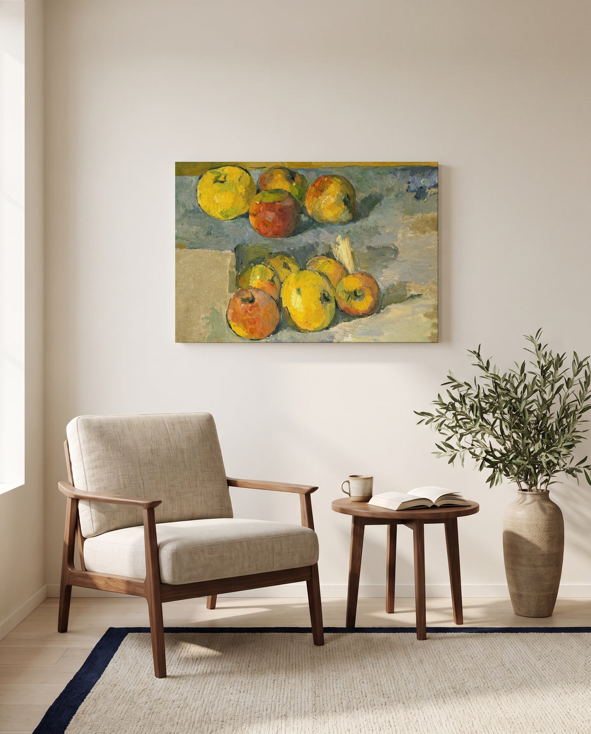 Apples by Paul Cézanne as a stretched canvas above a linen lounge chair in a reading corner