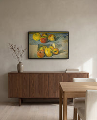 Apples by Paul Cézanne in a black frame above a walnut sideboard in a dining room