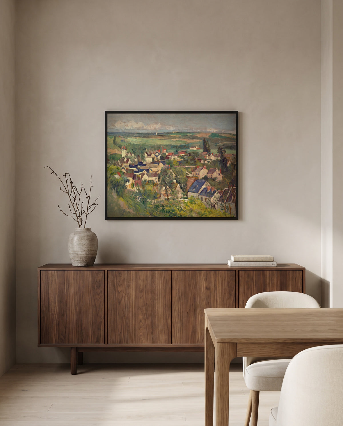 Auvers, Panoramic View by Paul Cézanne in a black frame above a walnut sideboard in a dining room