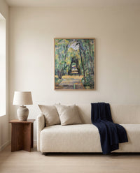 Avenue at Chantilly by Paul Cézanne framed in natural oak above a cream sofa in a warm living room