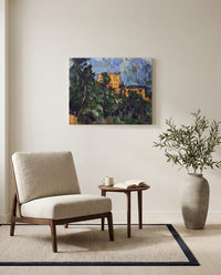 Château Noir by Paul Cézanne as a stretched canvas above a linen lounge chair in a reading corner