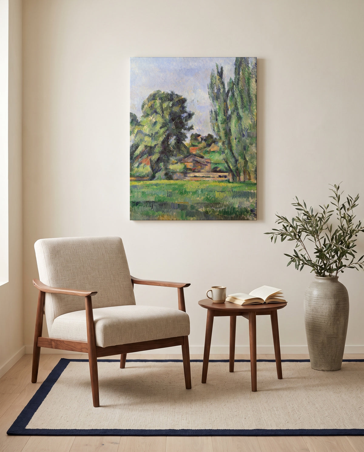 Landscape with Poplars by Paul Cézanne as a stretched canvas above a linen lounge chair in a reading corner