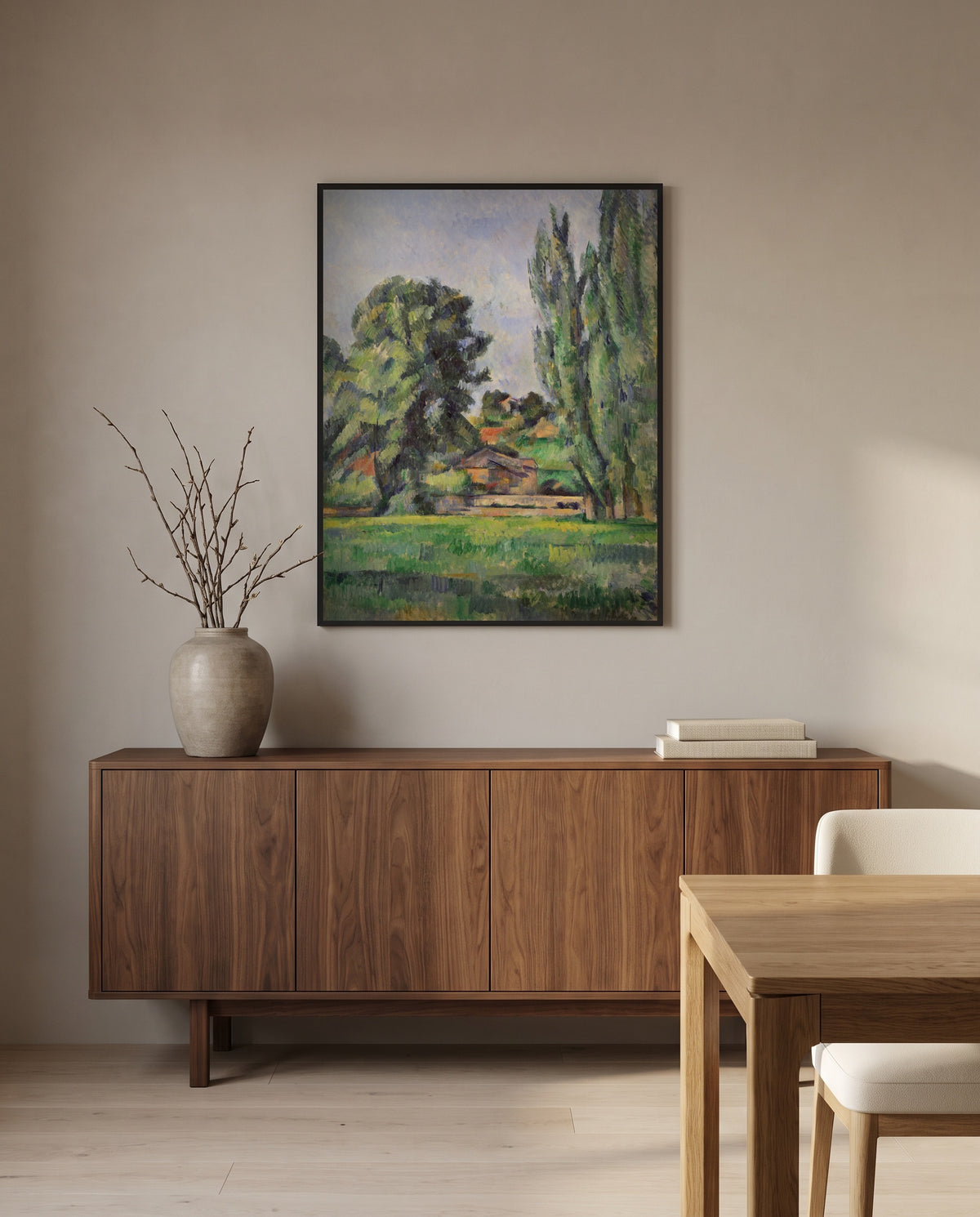 Landscape with Poplars by Paul Cézanne in a black frame above a walnut sideboard in a dining room
