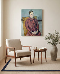 Madame Cézanne by Paul Cézanne as a stretched canvas above a linen lounge chair in a reading corner