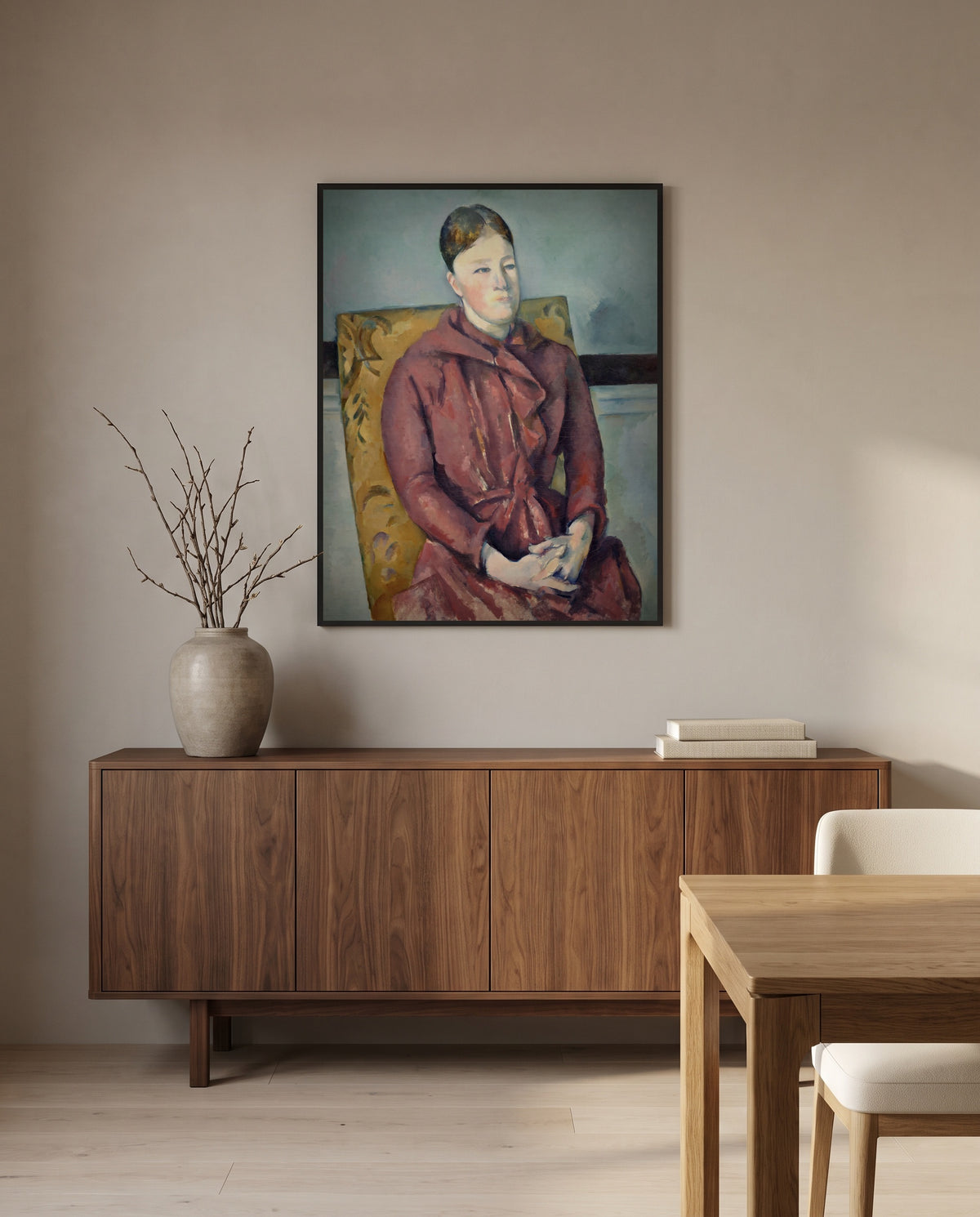 Madame Cézanne by Paul Cézanne in a black frame above a walnut sideboard in a dining room
