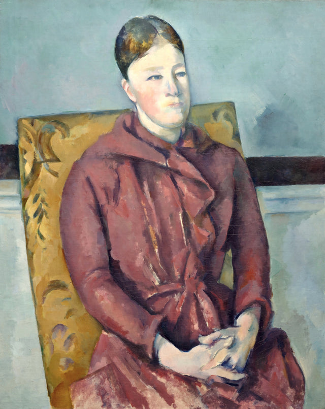 Madame Cézanne in a Yellow Chair by Paul Cézanne: a woman in a red dress, hands folded, seated in a yellow armchair