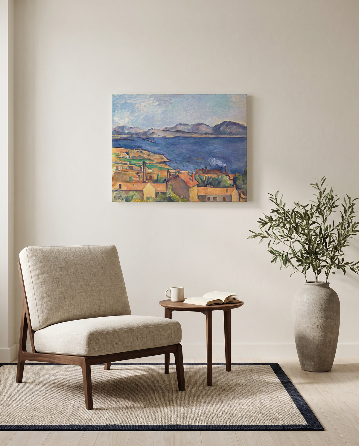 The Bay of Marseille by Paul Cézanne as a stretched canvas above a linen lounge chair in a reading corner