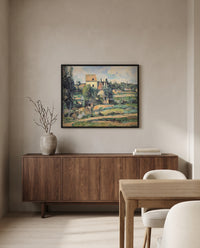 Mill at Pontoise by Paul Cézanne in a black frame above a walnut sideboard in a dining room