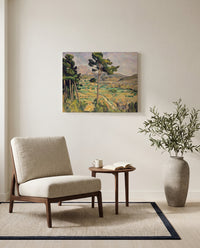 Sainte-Victoire and the Viaduct by Paul Cézanne as a stretched canvas above a linen lounge chair in a reading corner