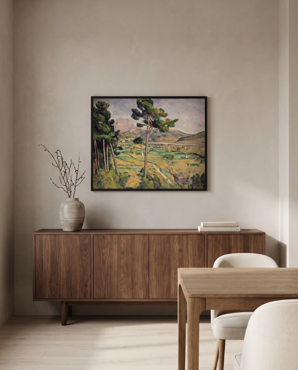 Sainte-Victoire and the Viaduct by Paul Cézanne in a black frame above a walnut sideboard in a dining room