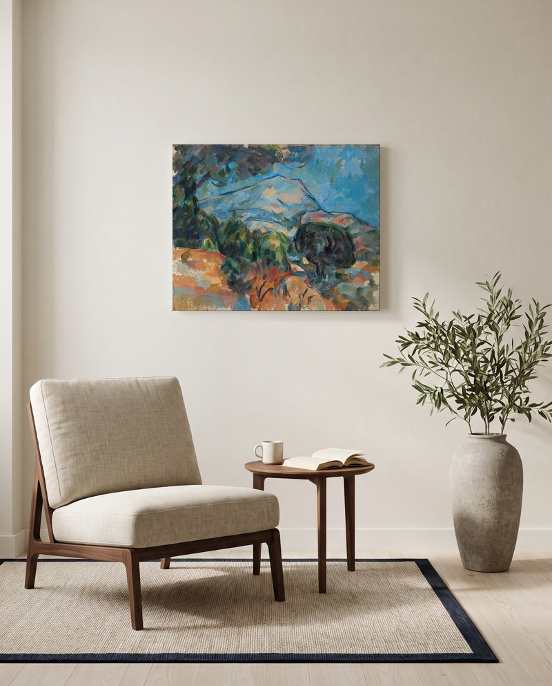 Mount Sainte-Victoire by Paul Cézanne as a stretched canvas above a linen lounge chair in a reading corner