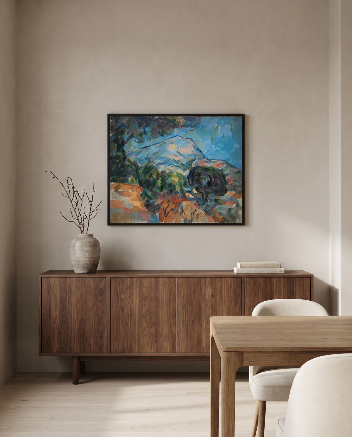 Mount Sainte-Victoire by Paul Cézanne in a black frame above a walnut sideboard in a dining room