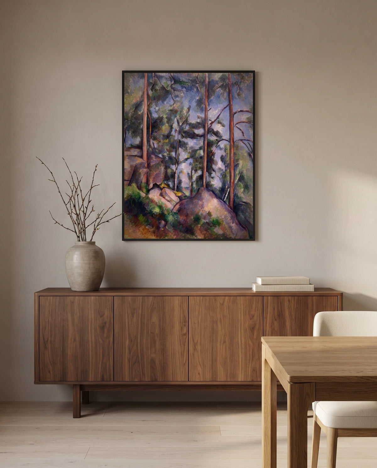 Pines and Rocks by Paul Cézanne in a black frame above a walnut sideboard in a dining room