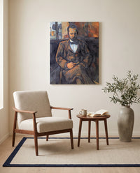 Ambroise Vollard by Paul Cézanne as a stretched canvas above a linen lounge chair in a reading corner