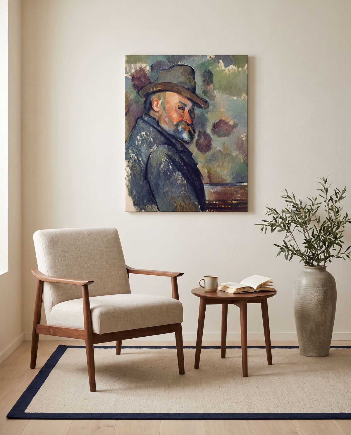 Self-Portrait with a Hat by Paul Cézanne as a stretched canvas above a linen lounge chair in a reading corner
