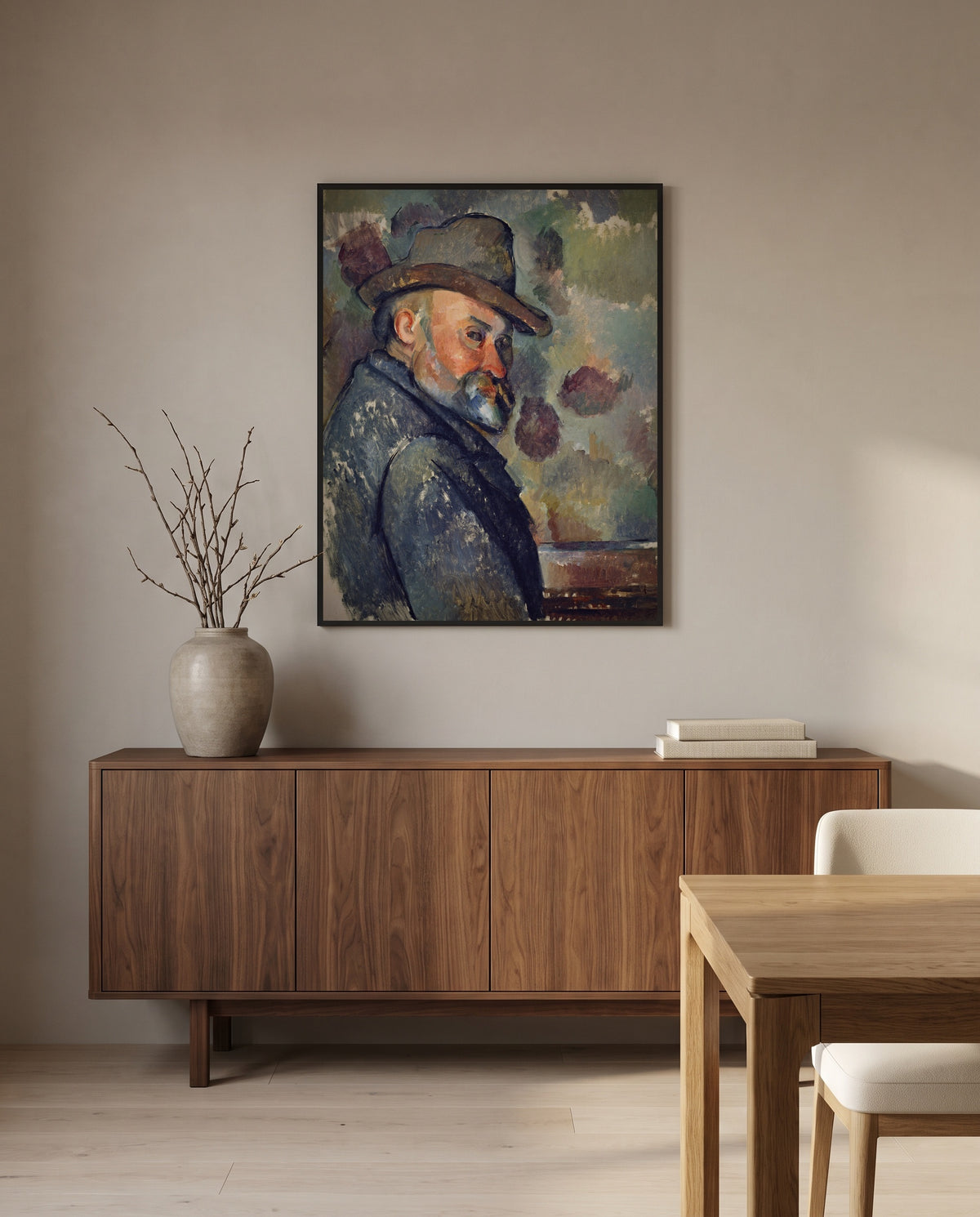 Self-Portrait with a Hat by Paul Cézanne in a black frame above a walnut sideboard in a dining room