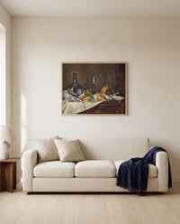 Still Life with a Dessert by Paul Cézanne framed in natural oak above a cream sofa in a warm living room