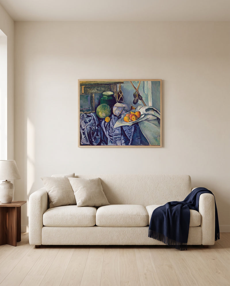 Ginger Jar and Eggplants by Paul Cézanne framed in natural oak above a cream sofa in a warm living room