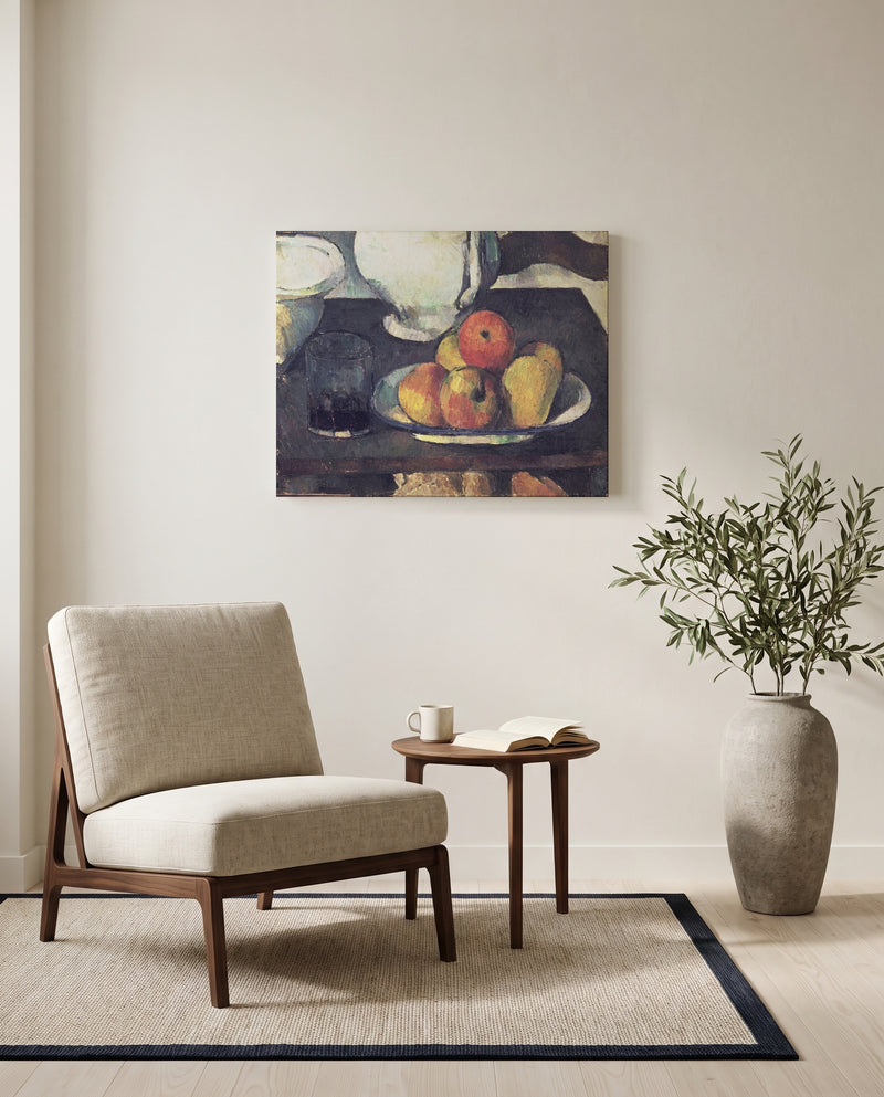 Apples and a Glass of Wine by Paul Cézanne as a stretched canvas above a linen lounge chair in a reading corner