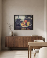 Apples and a Glass of Wine by Paul Cézanne in a black frame above a walnut sideboard in a dining room