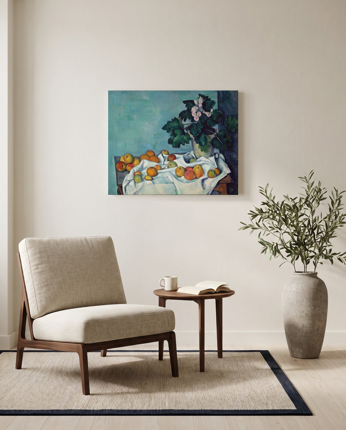 Apples and Primroses by Paul Cézanne as a stretched canvas above a linen lounge chair in a reading corner
