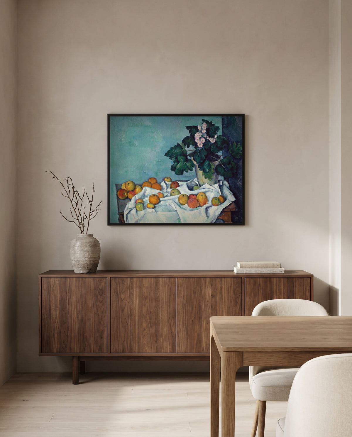 Apples and Primroses by Paul Cézanne in a black frame above a walnut sideboard in a dining room