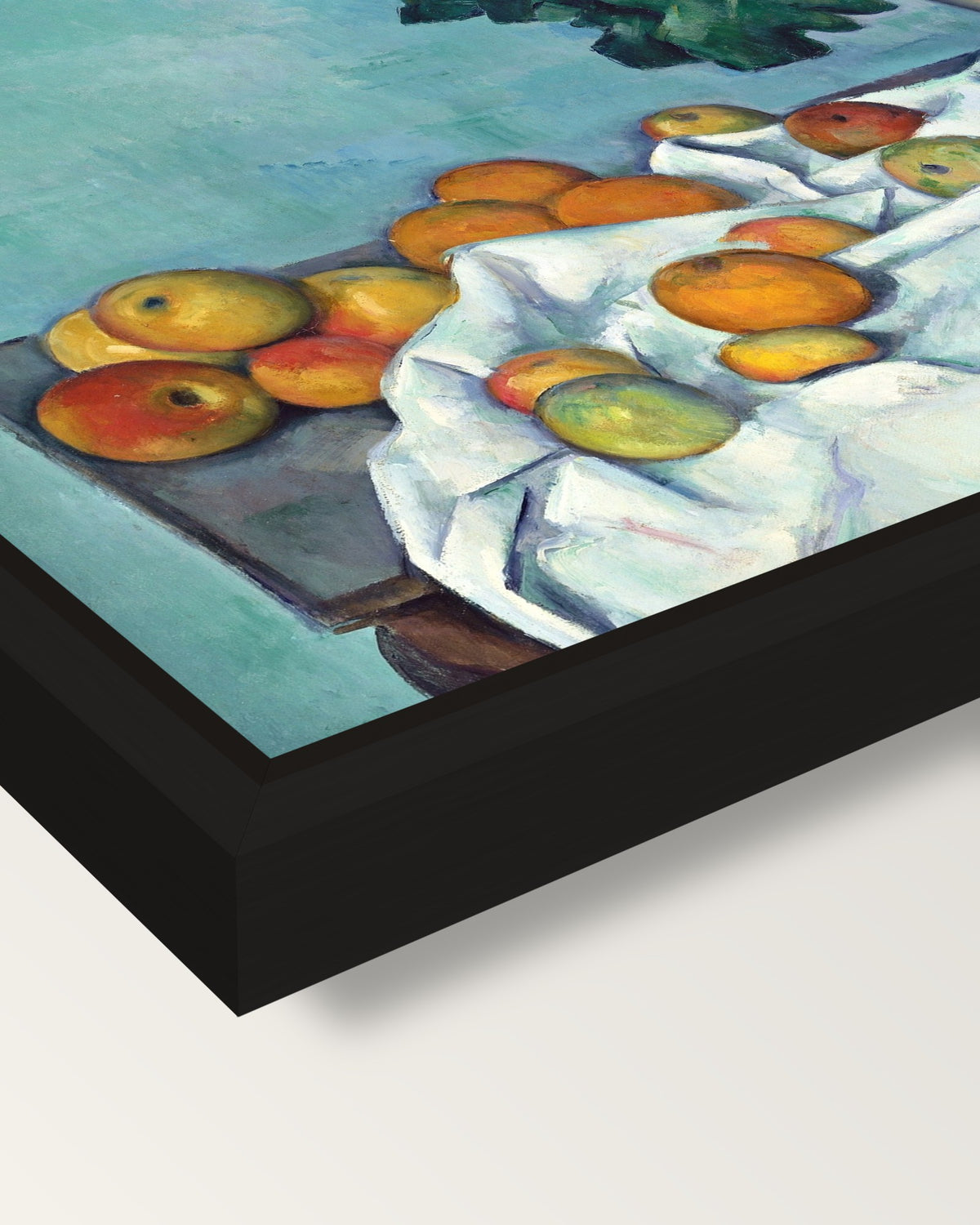 Apples and Primroses by Cézanne framed canvas, corner close-up: a black floating frame with a shadow gap round the canvas