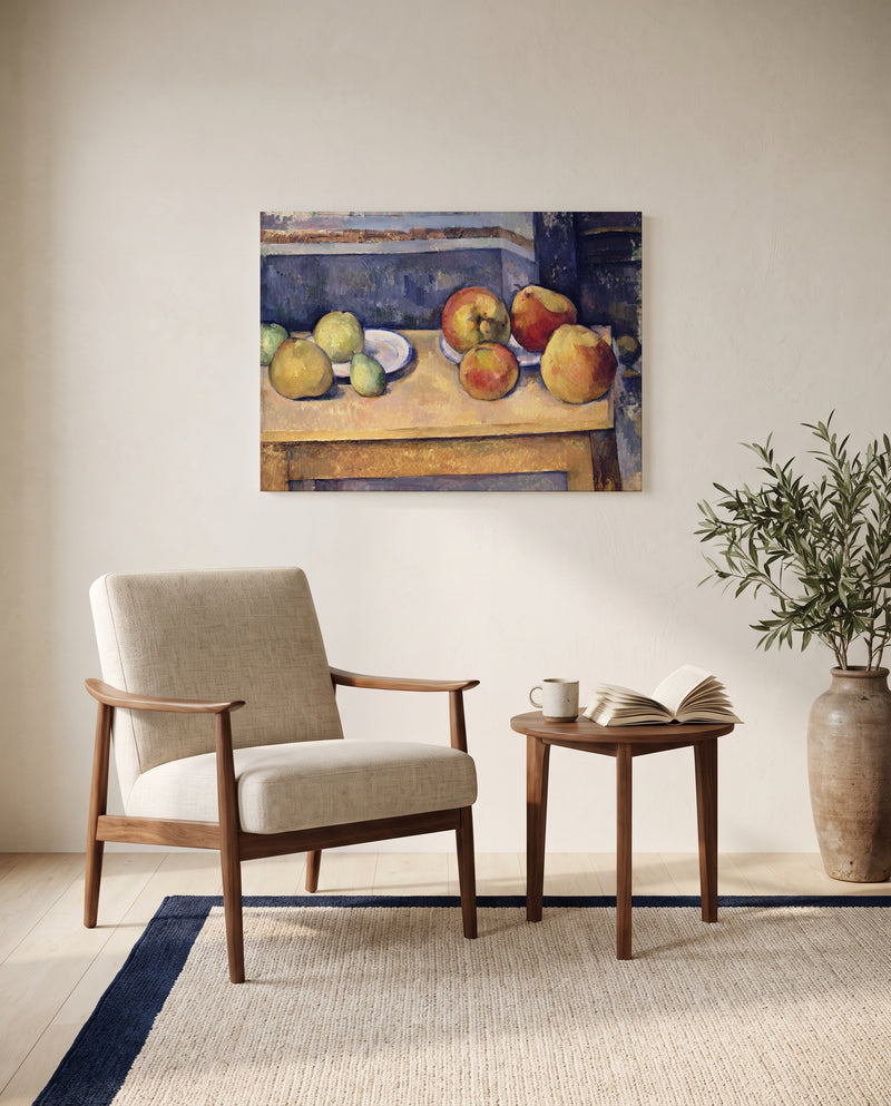 Apples and Pears by Paul Cézanne as a stretched canvas above a linen lounge chair in a reading corner