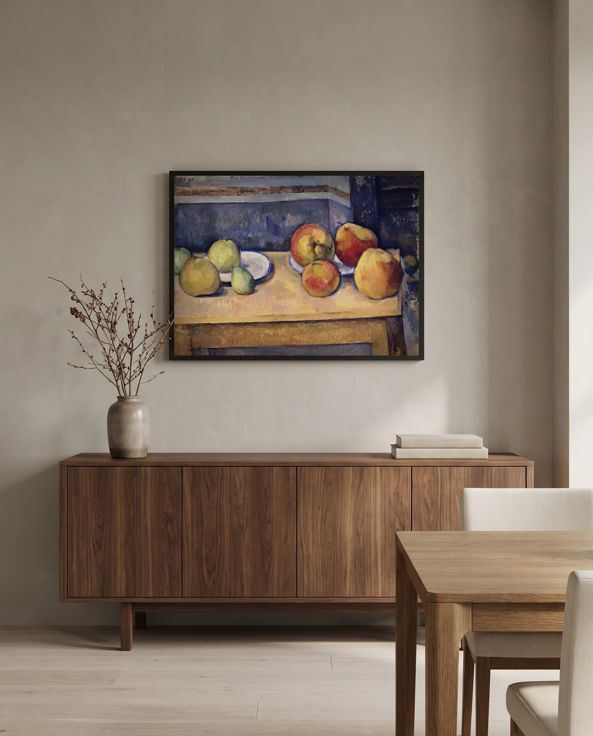 Apples and Pears by Paul Cézanne in a black frame above a walnut sideboard in a dining room