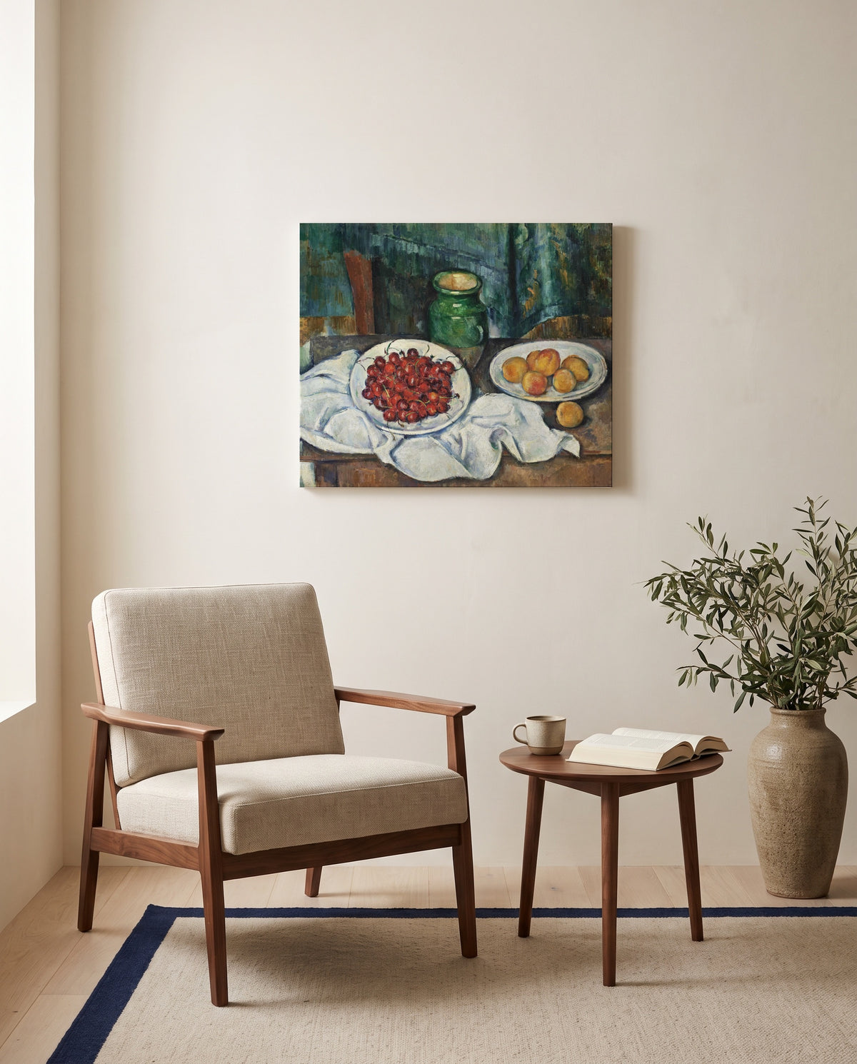 Cherries and Peaches by Paul Cézanne as a stretched canvas above a linen lounge chair in a reading corner