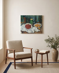 Cherries and Peaches by Paul Cézanne as a stretched canvas above a linen lounge chair in a reading corner