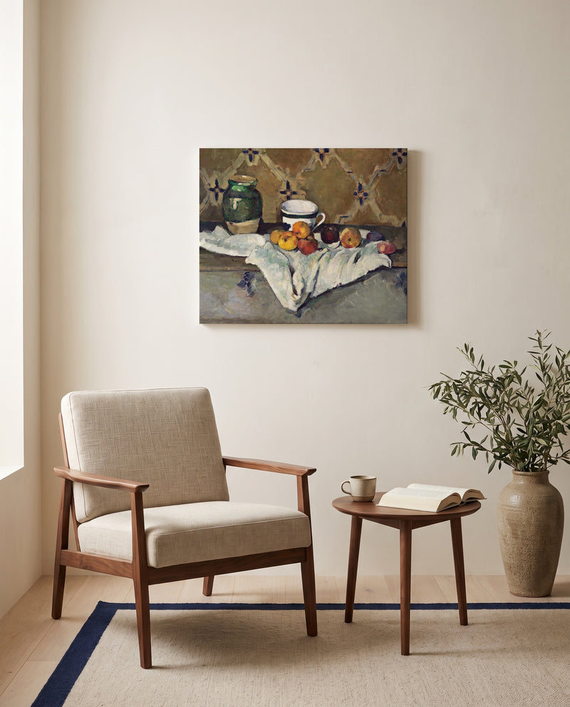 Jar, Cup and Apples by Paul Cézanne as a stretched canvas above a linen lounge chair in a reading corner