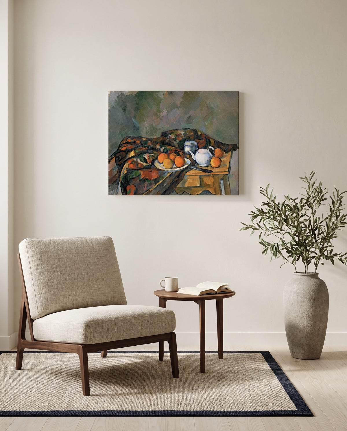 Still Life with Teapot by Paul Cézanne as a stretched canvas above a linen lounge chair in a reading corner
