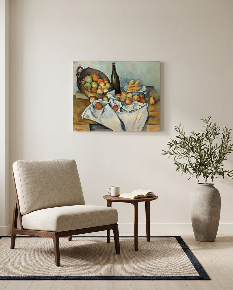 The Basket of Apples by Paul Cézanne as a stretched canvas above a linen lounge chair in a reading corner