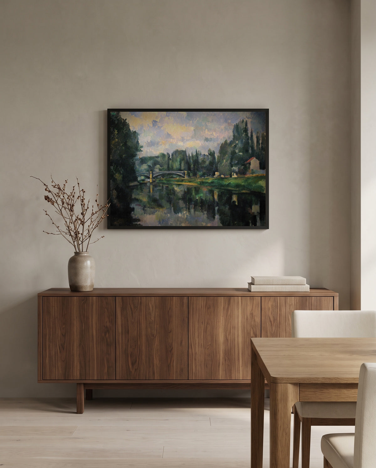 The Banks of the Marne by Paul Cézanne in a black frame above a walnut sideboard in a dining room