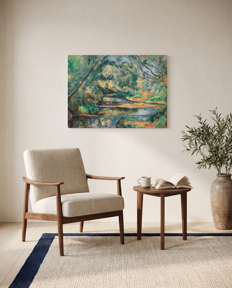The Brook by Paul Cézanne as a stretched canvas above a linen lounge chair in a reading corner