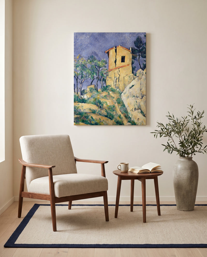 House with Cracked Walls by Paul Cézanne as a stretched canvas above a linen lounge chair in a reading corner