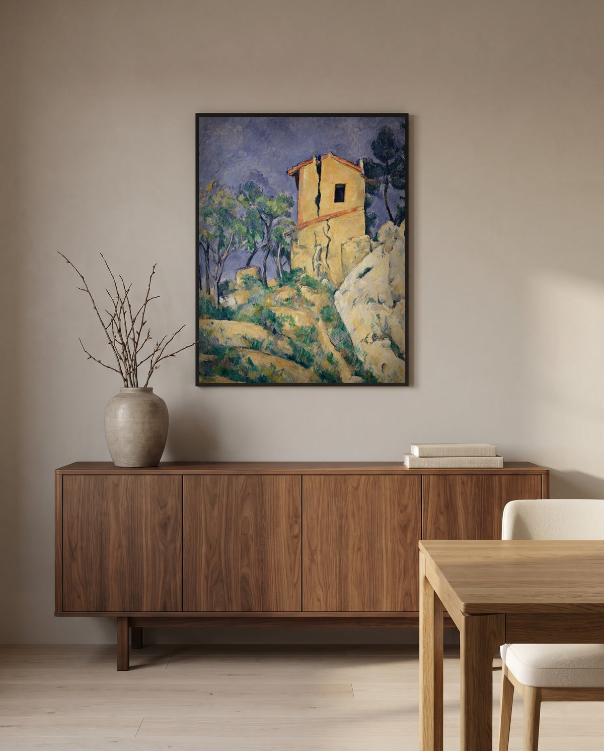 House with Cracked Walls by Paul Cézanne in a black frame above a walnut sideboard in a dining room