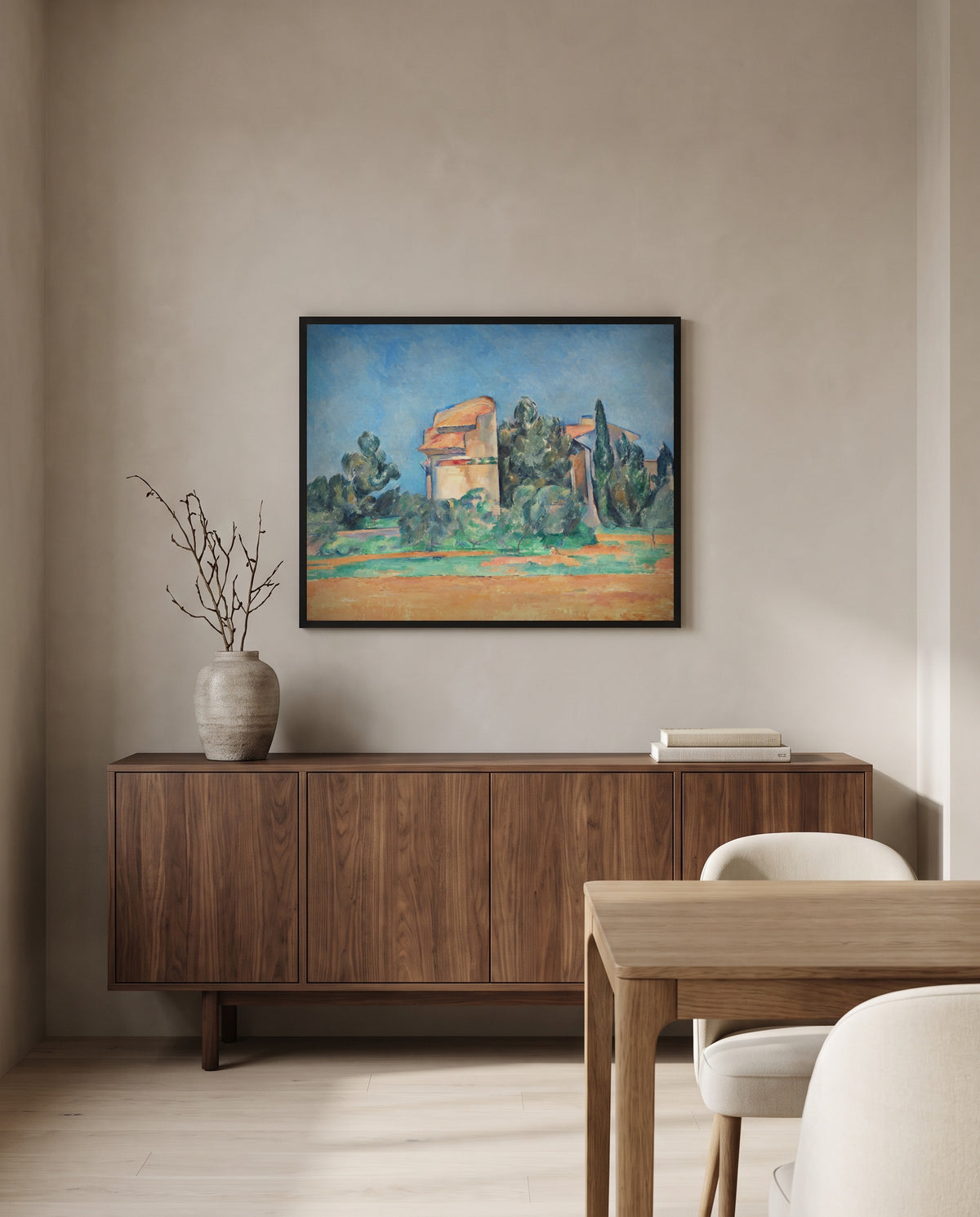 The Pigeon Tower at Bellevue by Paul Cézanne in a black frame above a walnut sideboard in a dining room