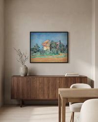 The Pigeon Tower at Bellevue by Paul Cézanne in a black frame above a walnut sideboard in a dining room