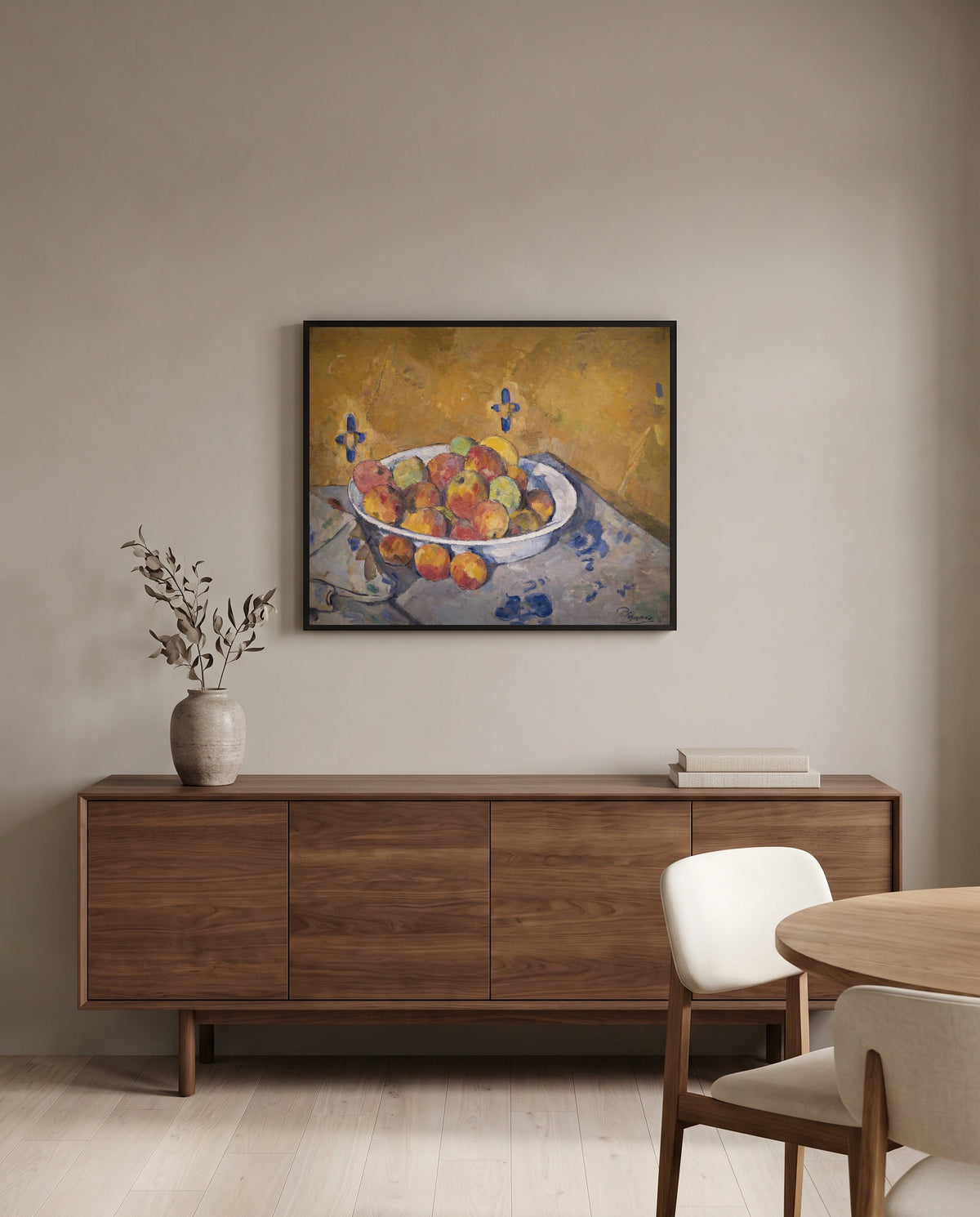 The Plate of Apples by Paul Cézanne in a black frame above a walnut sideboard in a dining room